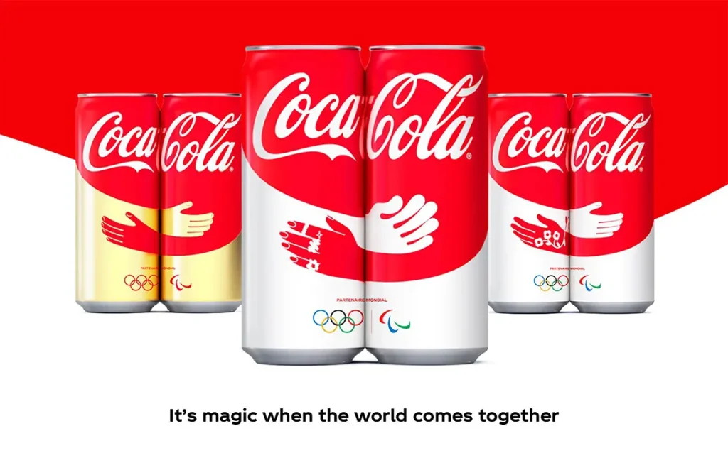 Latas de Coca-Cola París 2024 con diseño de abrazo