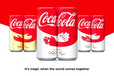 Latas de Coca-Cola París 2024 con diseño de abrazo