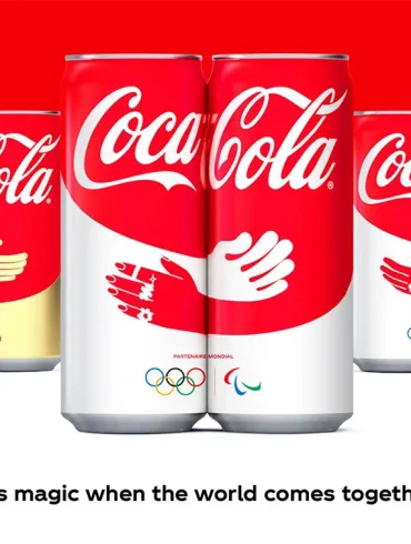 Latas de Coca-Cola París 2024 con diseño de abrazo
